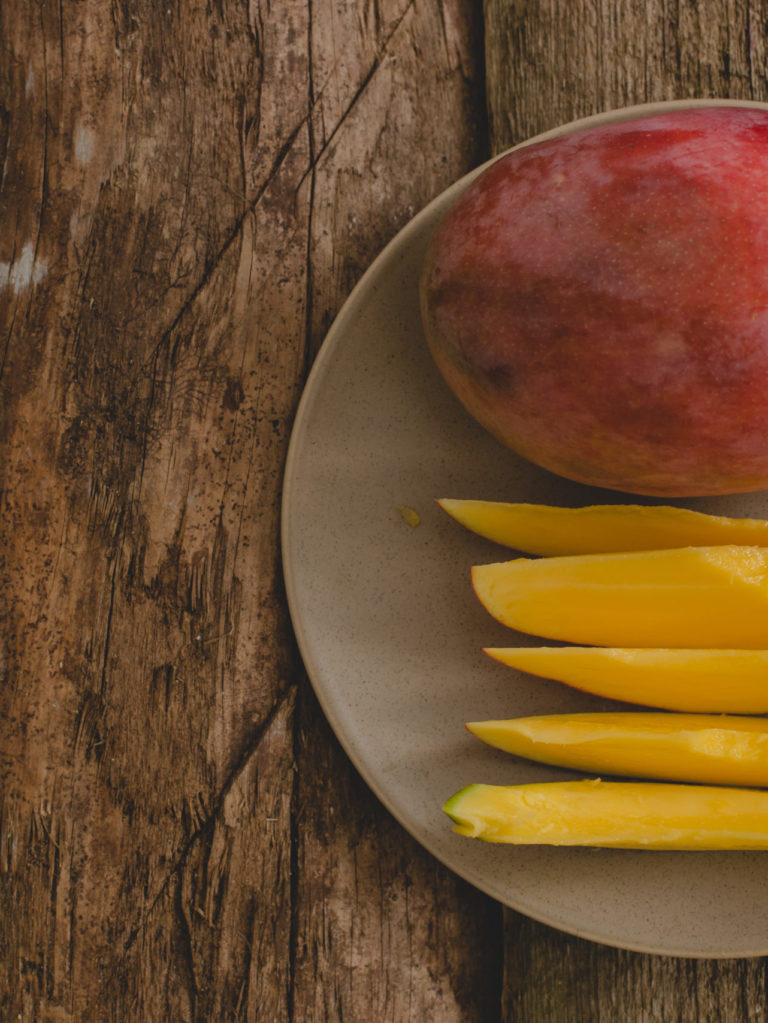 Mango on the table Fresh mango whole fruit and fresh cutted